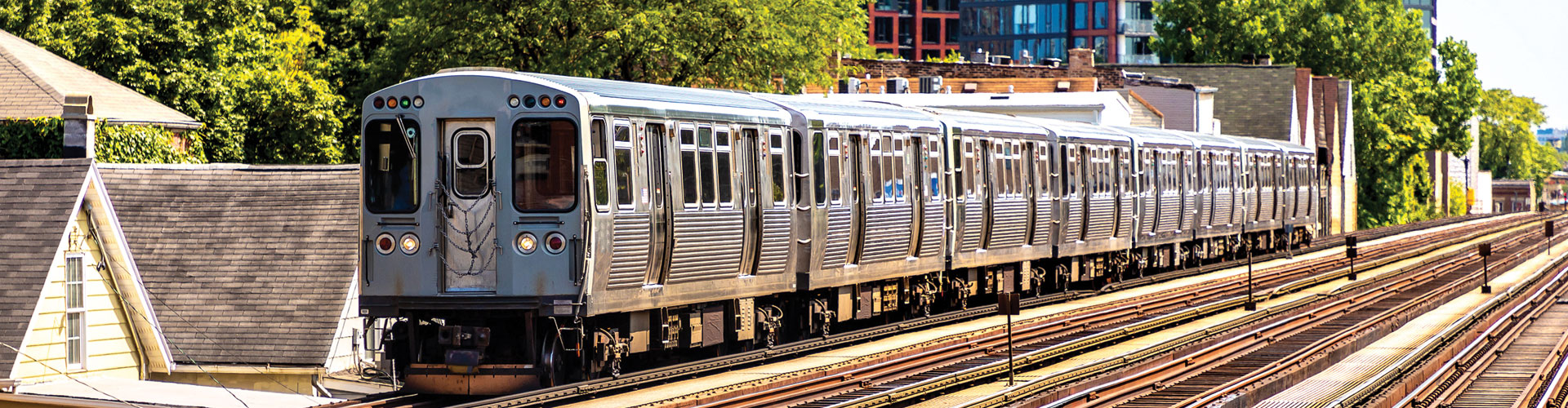 CTA train running on tracks through a residential area